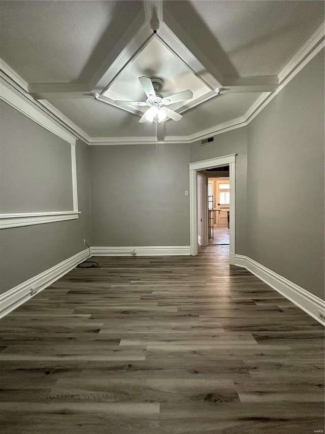 empty room with crown molding, dark hardwood / wood-style floors, and ceiling fan