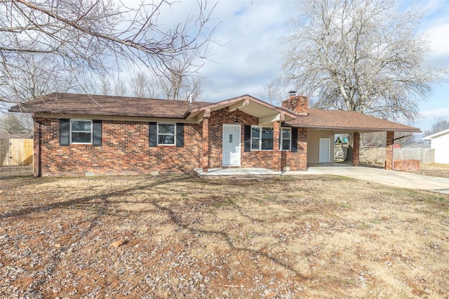 ranch-style home with a carport and a front yard