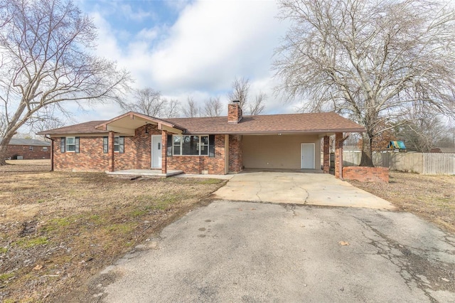 ranch-style home with a carport