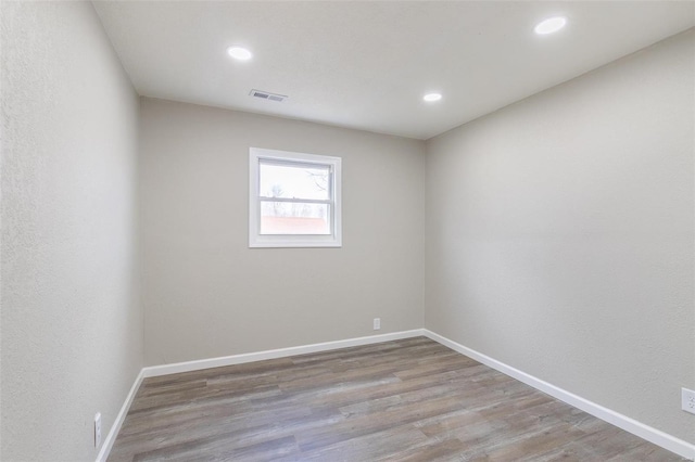 unfurnished room featuring light hardwood / wood-style flooring