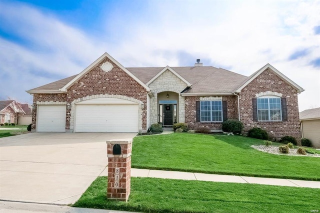 view of front facade featuring a garage and a front yard