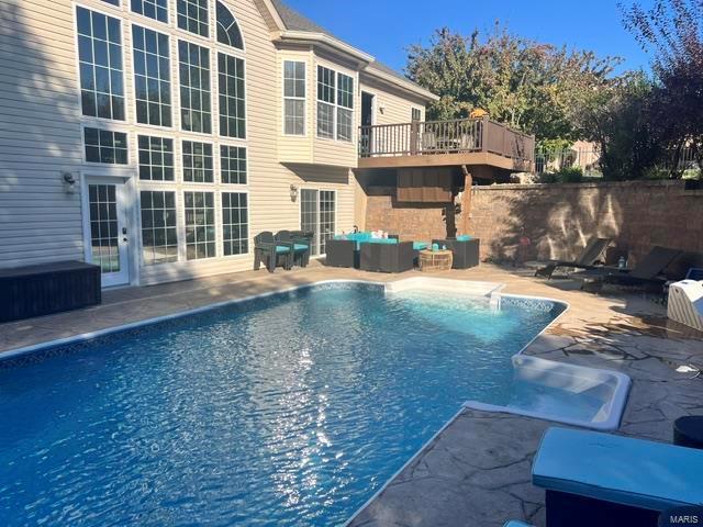 view of swimming pool with an outdoor hangout area and a patio area