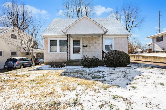 bungalow featuring a shingled roof