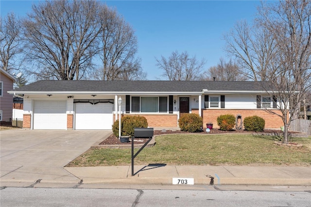 ranch-style house with a garage, driveway, a front lawn, and brick siding