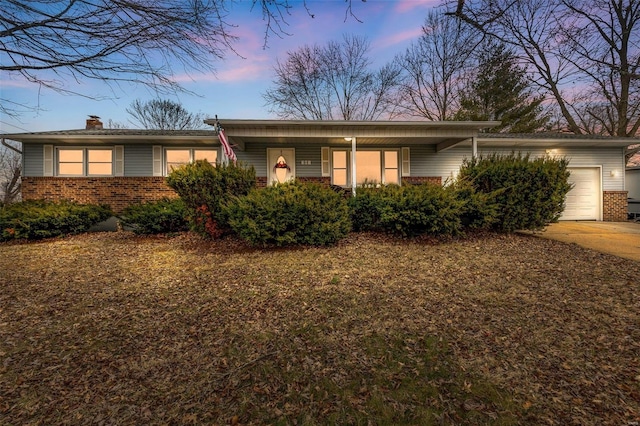 single story home with a garage