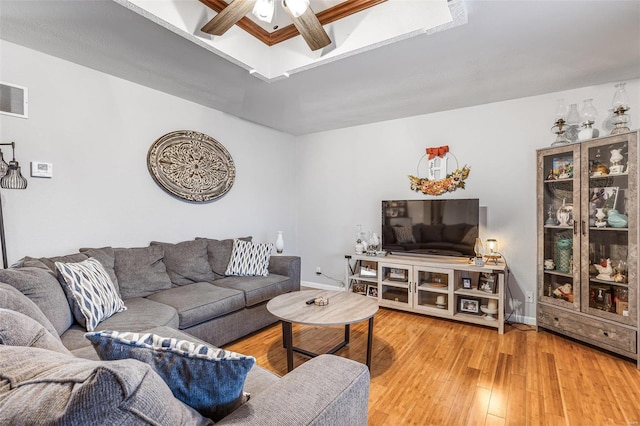 living room featuring ceiling fan and hardwood / wood-style floors