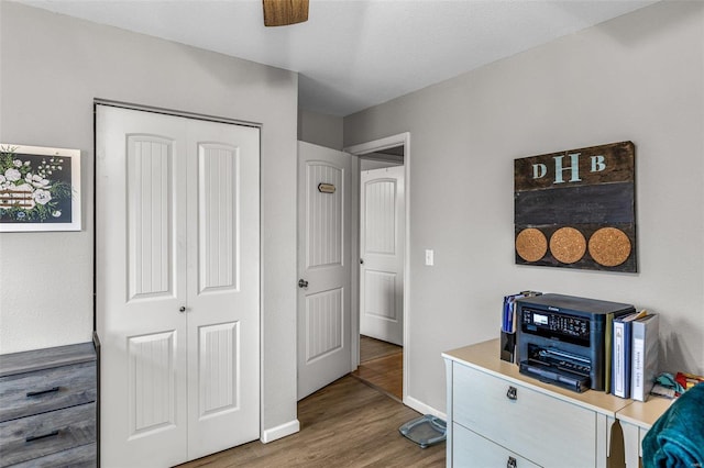 office area with hardwood / wood-style flooring and ceiling fan