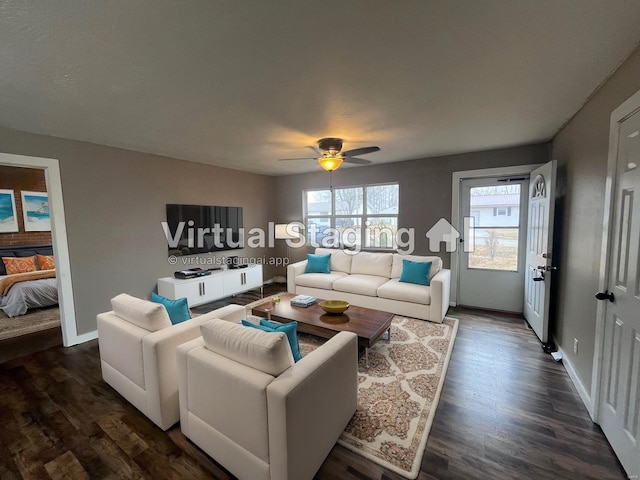 living room with ceiling fan and dark hardwood / wood-style floors