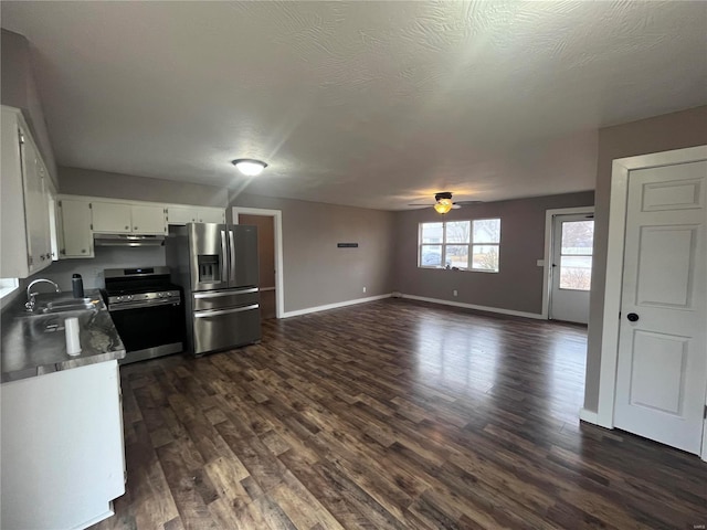 kitchen featuring sink, white cabinetry, appliances with stainless steel finishes, dark hardwood / wood-style flooring, and ceiling fan