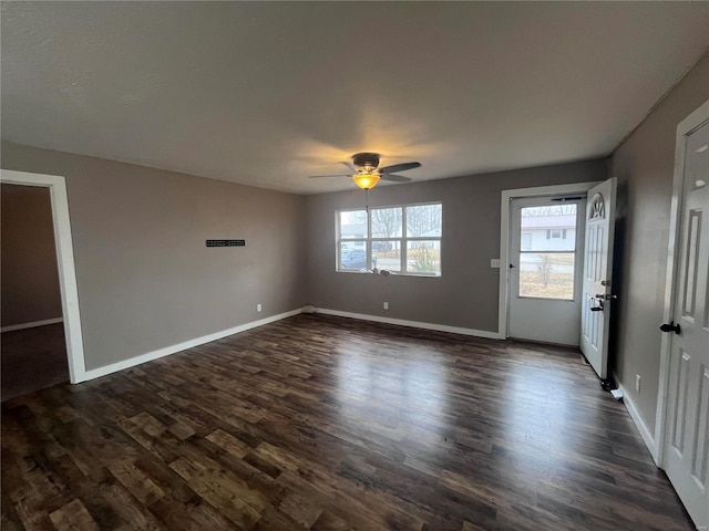 interior space featuring ceiling fan and dark hardwood / wood-style floors