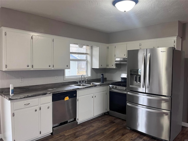 kitchen featuring sink, dark wood-type flooring, stainless steel appliances, and white cabinets