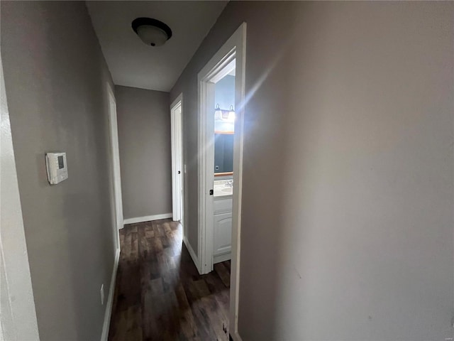 hall with dark hardwood / wood-style floors