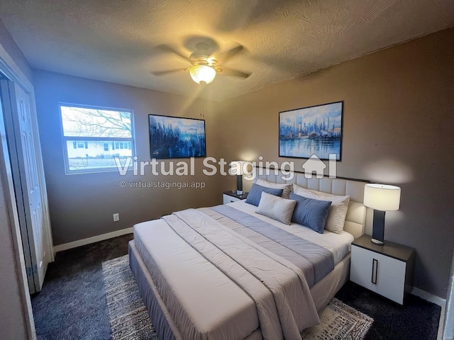 carpeted bedroom with ceiling fan and a textured ceiling