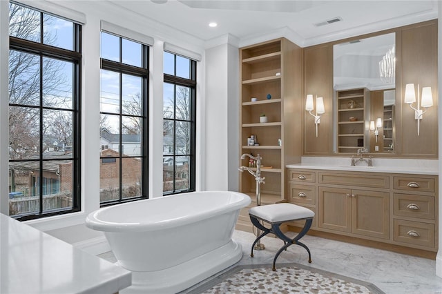 full bath featuring built in shelves, vanity, visible vents, marble finish floor, and a soaking tub