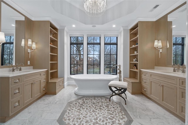 full bathroom featuring built in shelves, visible vents, and a sink