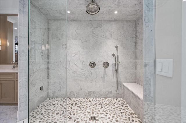 bathroom featuring a stall shower and vanity