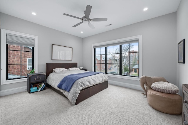 carpeted bedroom with baseboards, ceiling fan, visible vents, and recessed lighting