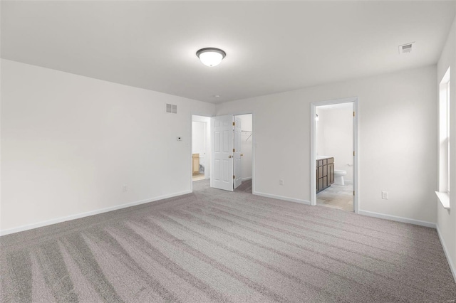 empty room with light colored carpet