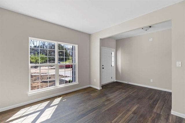 empty room featuring dark hardwood / wood-style flooring