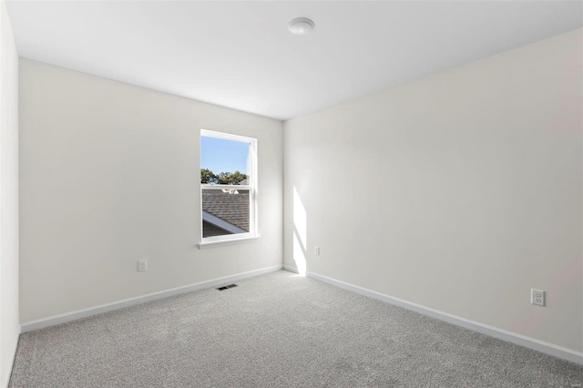 empty room featuring carpet flooring