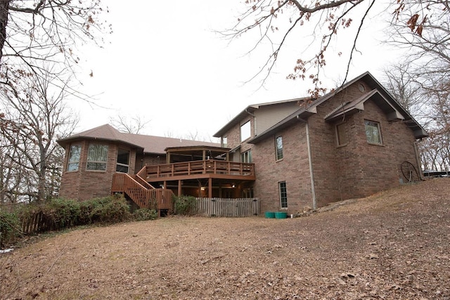 back of house with a deck