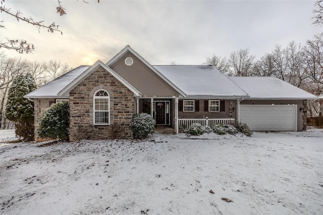 view of front of property featuring a porch and a garage