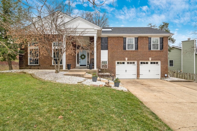 view of front of property with a garage and a front lawn