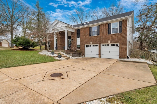 view of front facade with a garage and a front lawn