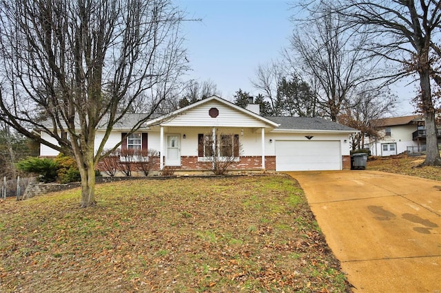 single story home featuring a garage, a front yard, and covered porch