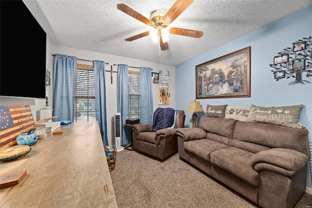 living room featuring ceiling fan, carpet, and a textured ceiling