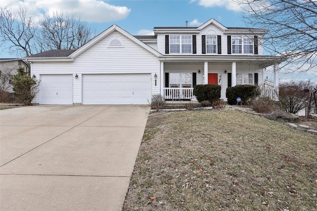 view of property featuring a porch, a garage, and a front yard