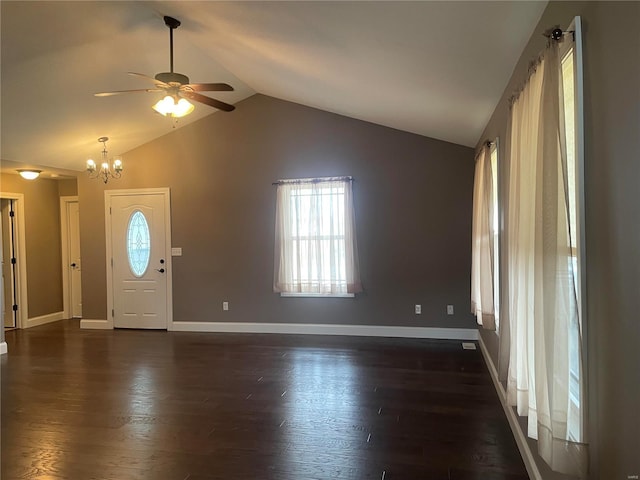 entrance foyer with lofted ceiling, dark hardwood / wood-style floors, and ceiling fan with notable chandelier