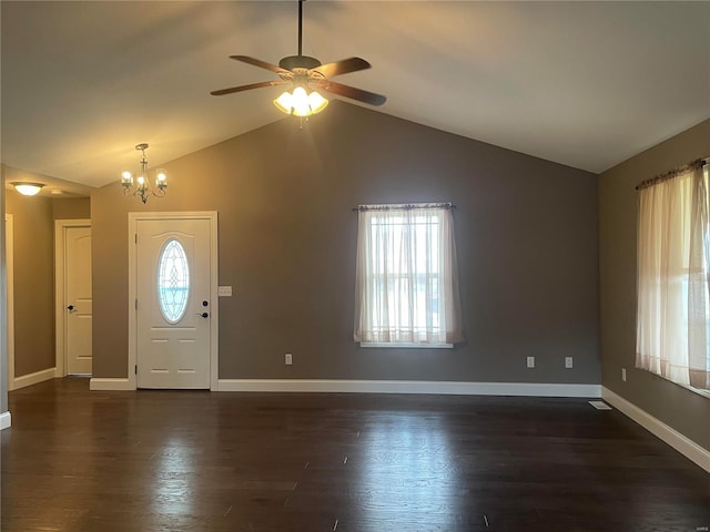 foyer entrance with vaulted ceiling, a healthy amount of sunlight, and dark hardwood / wood-style floors