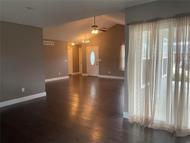 foyer featuring lofted ceiling, dark hardwood / wood-style floors, and a healthy amount of sunlight