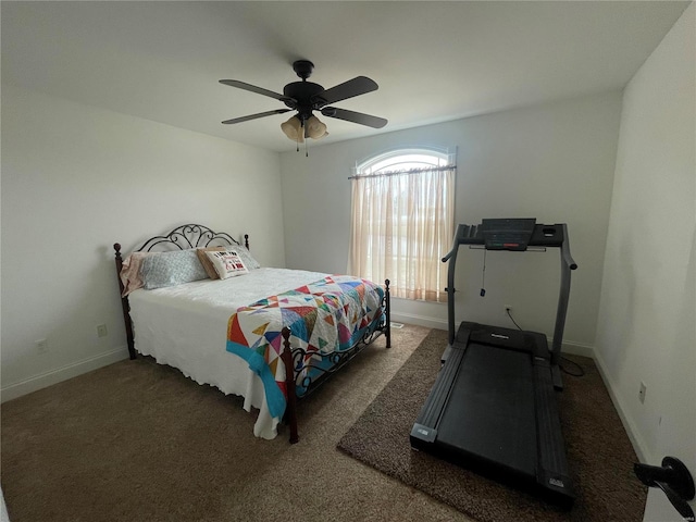 bedroom with ceiling fan and dark colored carpet