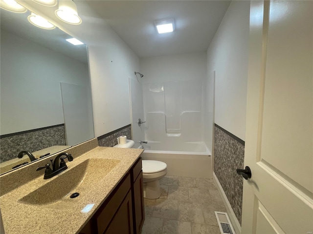 full bathroom with vanity, tub / shower combination, and toilet