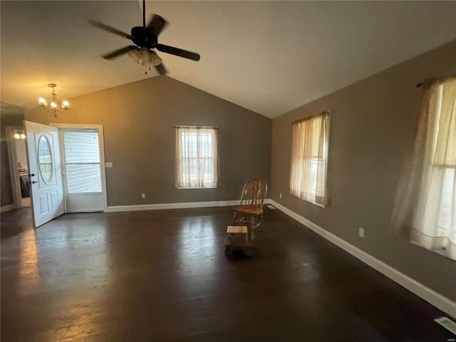 interior space with lofted ceiling and ceiling fan with notable chandelier