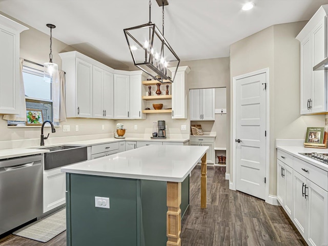 kitchen featuring dark wood-style floors, open shelves, stainless steel dishwasher, and white cabinetry