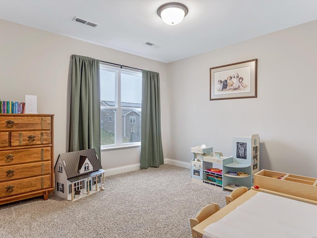 carpeted bedroom featuring visible vents and baseboards