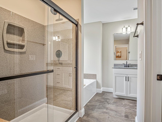 bathroom featuring a garden tub, visible vents, vanity, baseboards, and a stall shower