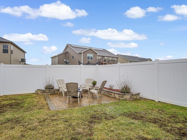 view of yard with a fenced backyard and a patio