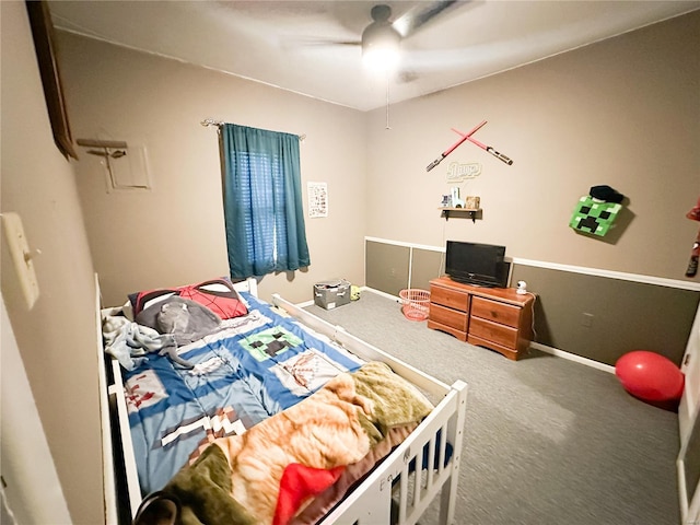 bedroom with ceiling fan and carpet flooring