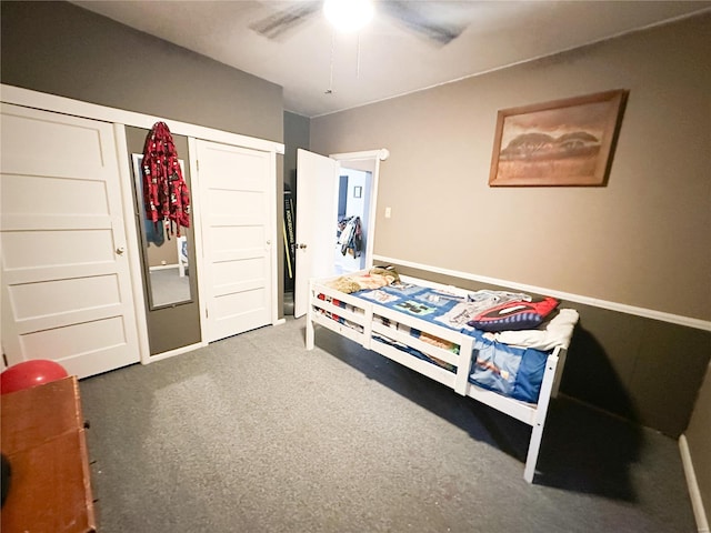 carpeted bedroom featuring ceiling fan