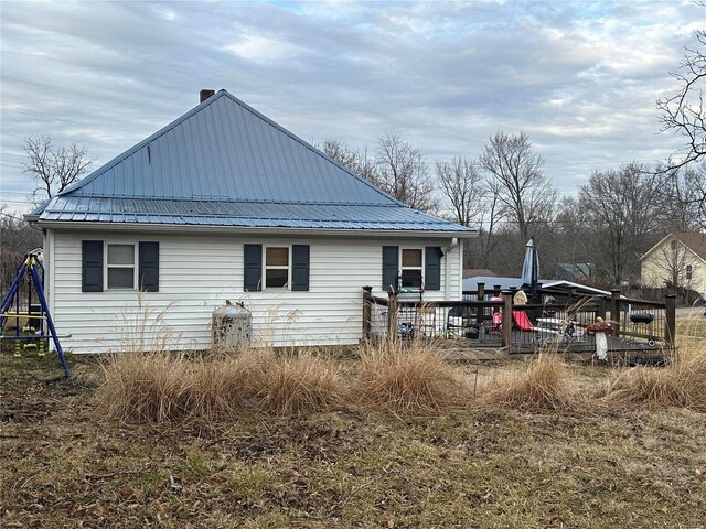 view of property exterior featuring a playground