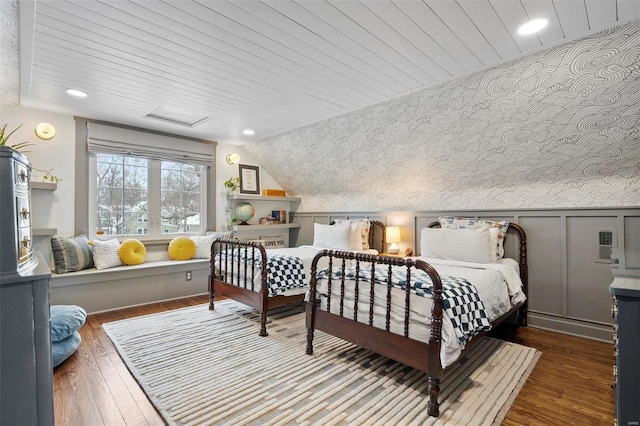 bedroom with vaulted ceiling, dark hardwood / wood-style floors, and wooden ceiling