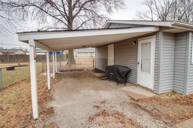 view of vehicle parking with a carport