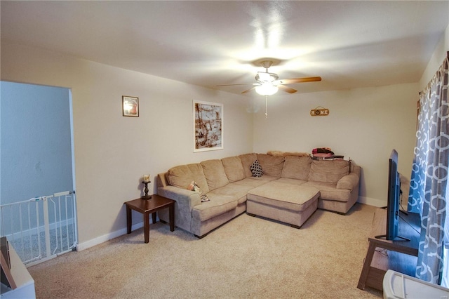 carpeted living room featuring ceiling fan