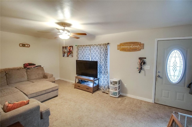 living room with ceiling fan and light colored carpet