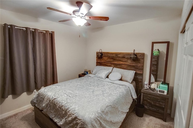 bedroom featuring light colored carpet and ceiling fan