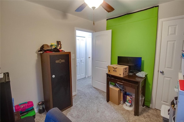 office area featuring light carpet and ceiling fan